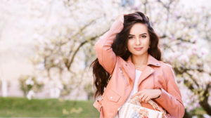 Outdoor portrait of young beautiful fashionable lady holding white bag, wearing pink leather jacket | Cute Spring Pastel Outfits For 2020 | spring dress outfits | Featured