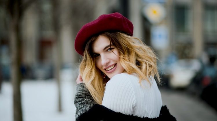 Smiling Woman Wearing Red Hat | 10 Cozy Cute Winter Outfits For Work | Looks For Your Busy Week | Featured