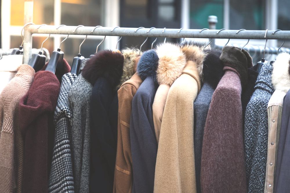 Coats Hanged On Clothes Rack | Winter Coat Guide | 9 Ideas To Finding The Right One For You