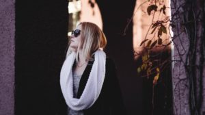 Portrait of woman wearing sunglassses | 12 Cute Christmas Outfits You Can Wear In Your Office Party | Featured