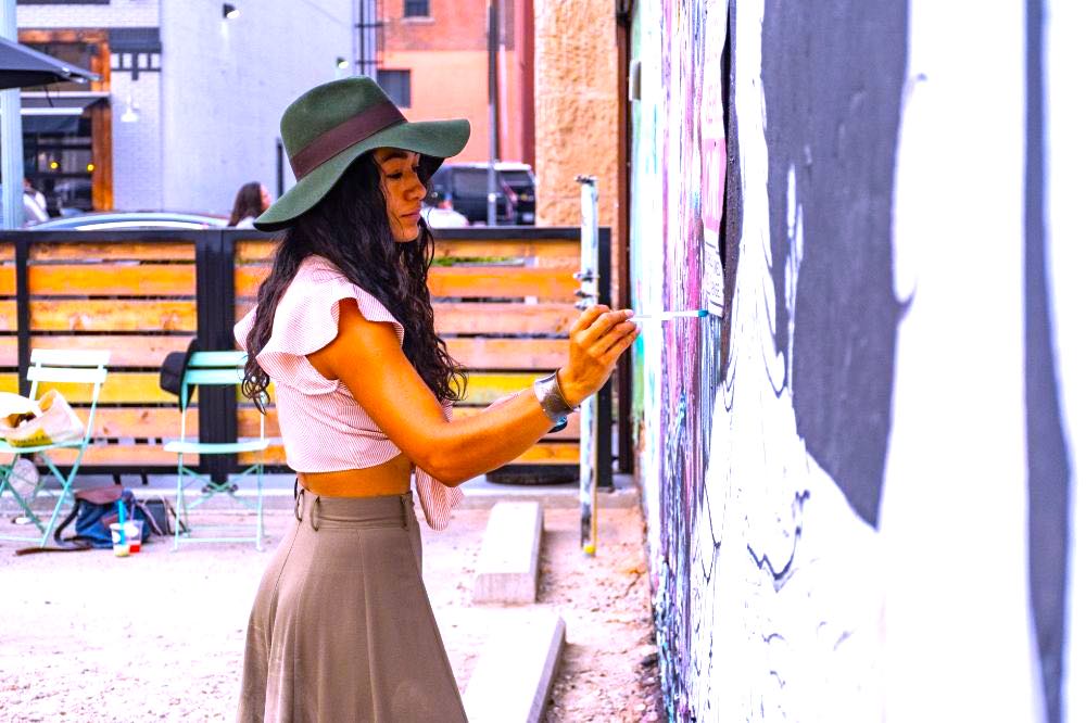 Woman Painting on Wall | 180 Cute Outfits for Every Season, Mood, Texture & Hue
