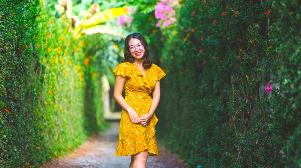 Woman Smiling While Wearing Yellow Floral Dress | 180 Cute Outfits for Every Season, Mood, Texture & Hue | Featured