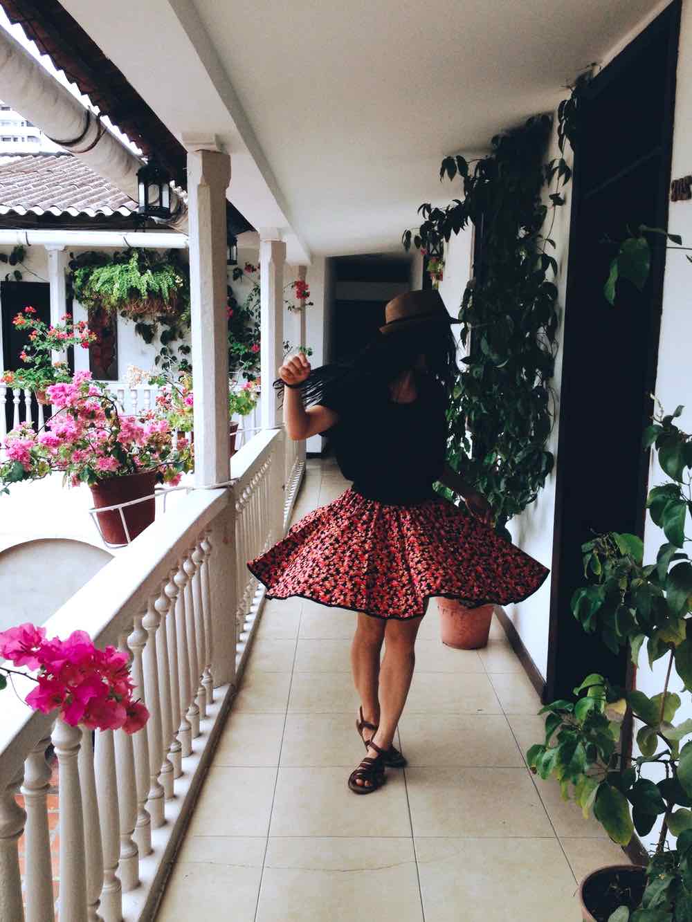 Woman Dancing In Hallway | 13 Cute College Outfit Ideas That'll Make You Look Trendy