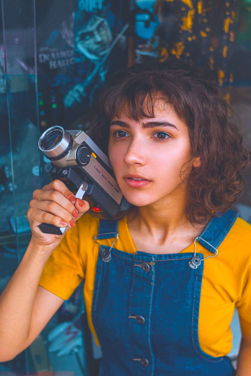 Woman Holding Video Camera | 13 Cute College Outfit Ideas That'll Make You Look Trendy