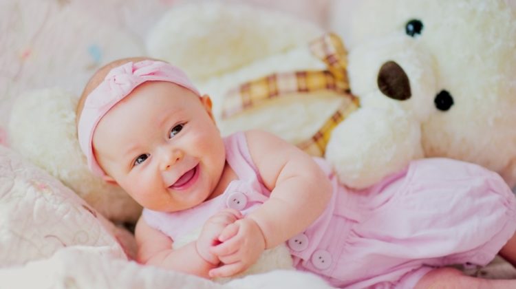 Smiling Girl With Teddy Bear | Cute Baby Girl Easter Outfits That Will Look Great On Your Daughter | Featured