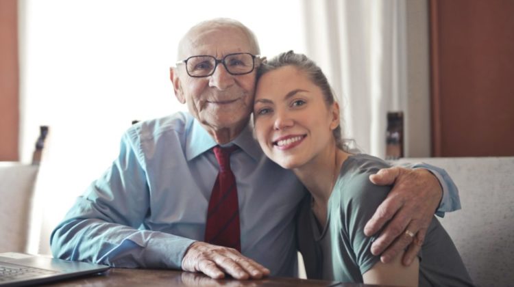 Positive senior man in formal wear and eyeglasses hugging | Budget-Friendly Gifts For A Dad Who Wants Nothing | gifts for dad | Featured