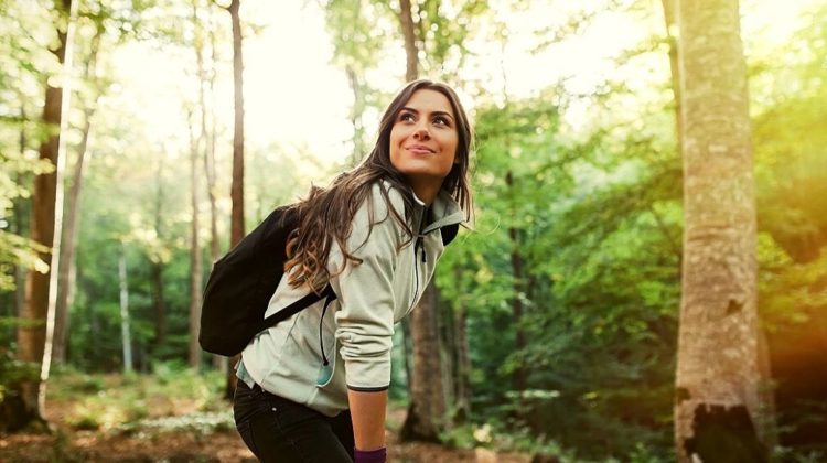Young woman inside a forest | 9 Cute And Comfy Hiking Outfit Ideas To Explore Nature In Style | Featured