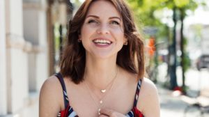 Woman in a beautiful dress smiling | XX Trendiest Layered Necklaces To Upgrade Your Cute Outfits | Featured