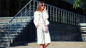 woman on street wearing a pair of long short and blazer | How To Wear The Long Shorts Trend And Look Stylish | Featured
