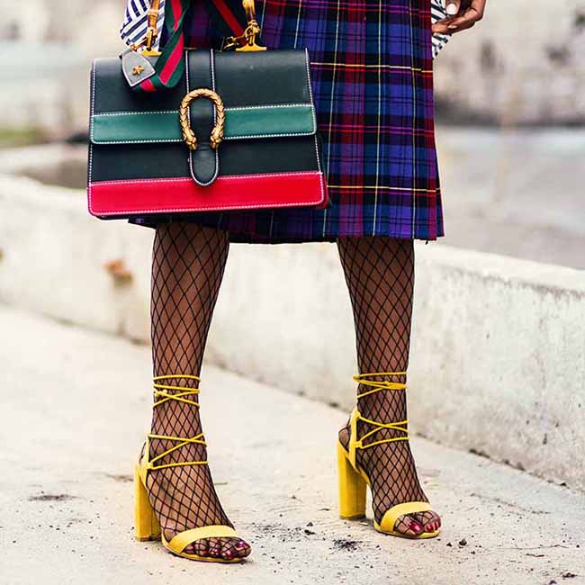 woman holding green and red leather handbag wearing a yellow strappy sandals | Strappy Sandals For Your Cute Laidback Outfits