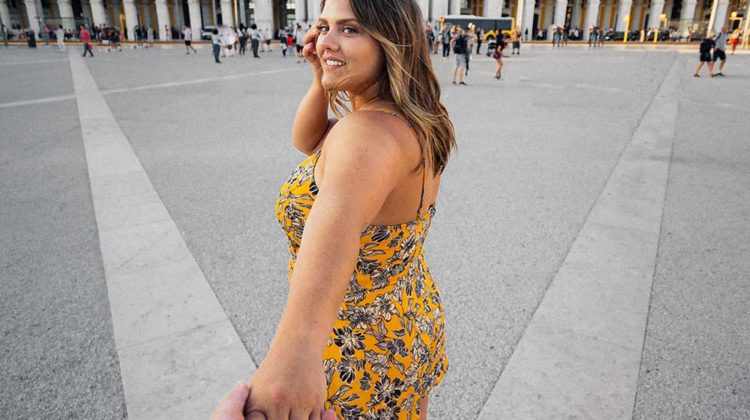 woman in blue and yellow floral spaghetti strap standing on gray concrete floor during daytime | Playsuits To Wea When It's Too Warm For Jumpsuits | Featured