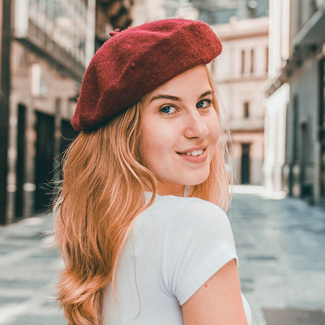photo of woman wearing red hat | Ways To Pull Off Fall Hats This Season | fall season