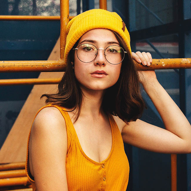 photo of woman wearing yellow beanie | Ways To Pull Off Fall Hats This Season