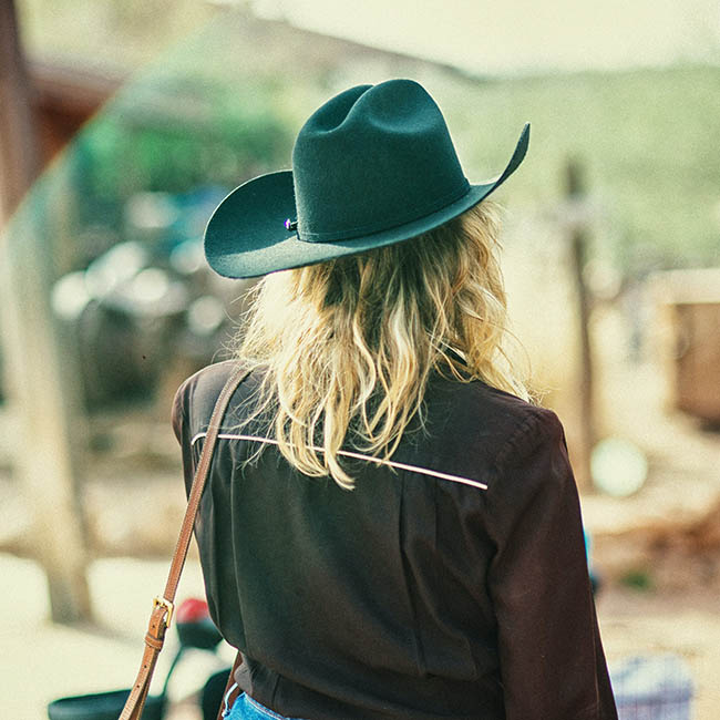 woman wearing black cowboy hat | Ways To Pull Off Fall Hats This Season